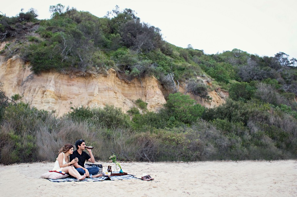 couple engagement photos of picnic on the beach in Melbourne